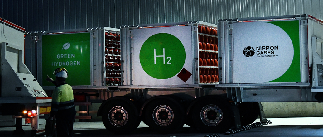 a person standing next to a large truck