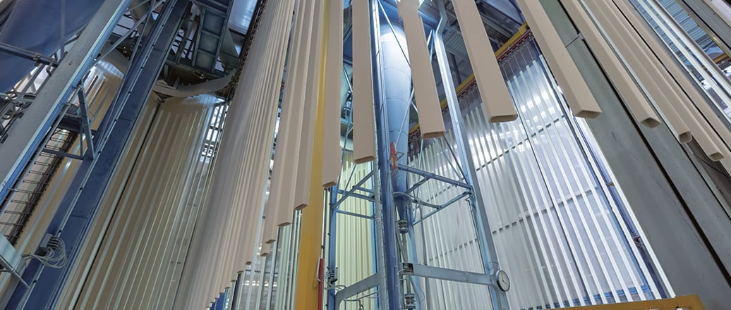 a group of people walking down a hall way