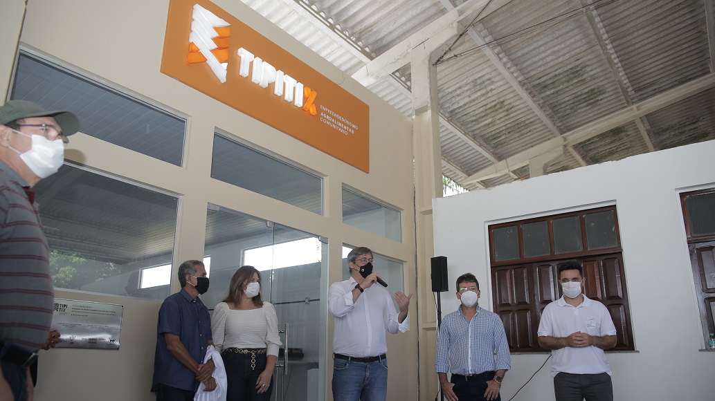 a group of people standing outside a building