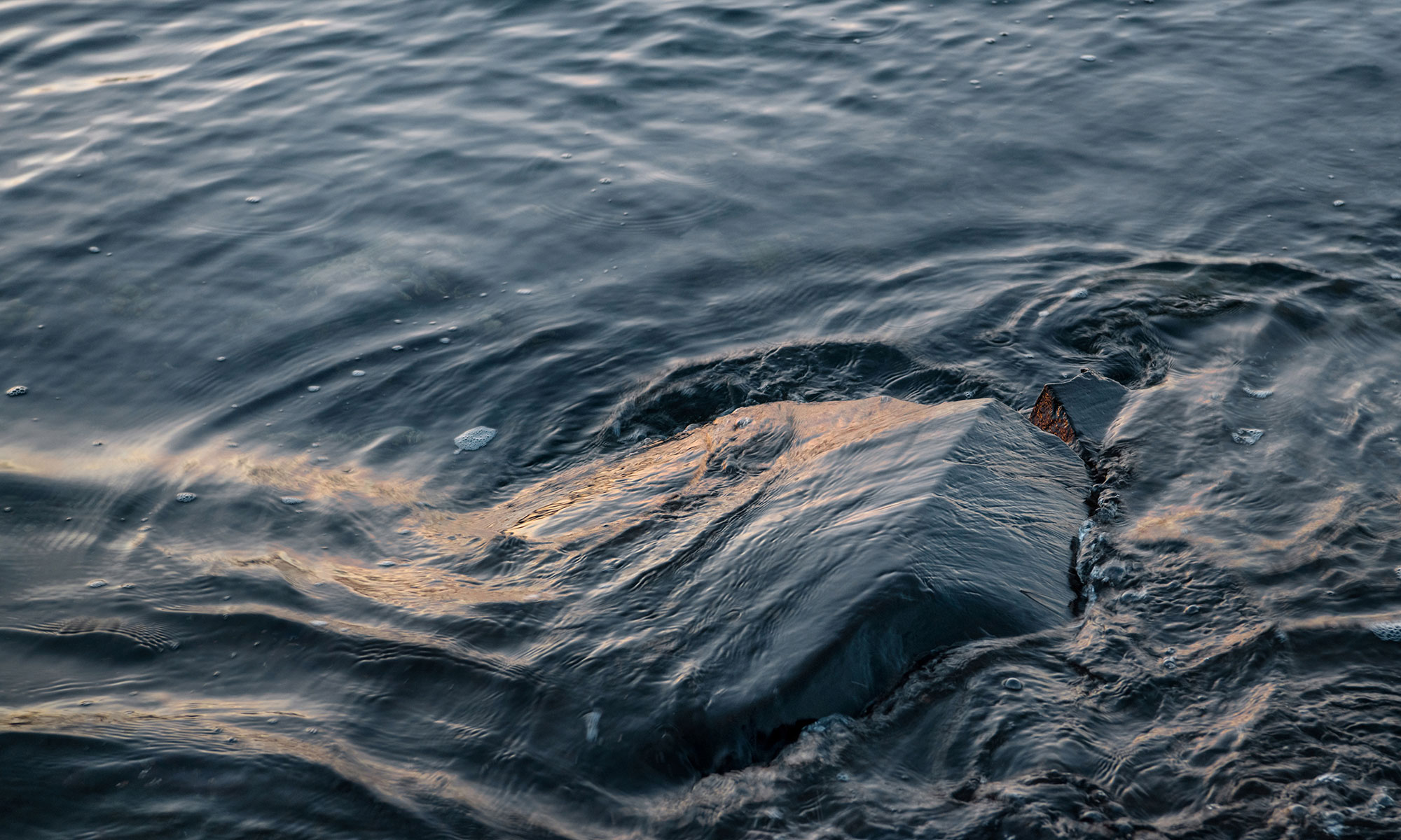 Water flowing over a rock