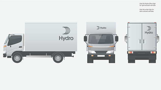 small van with large logo on back top, front and center above cab, top right back door