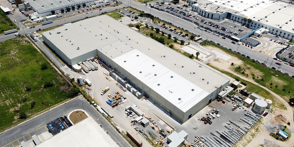 a large building with a parking lot