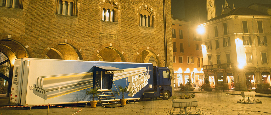 open square in old european city. Large truck with hydro logo on side.
