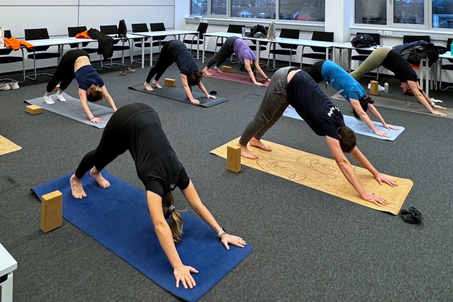 a group of people doing yoga