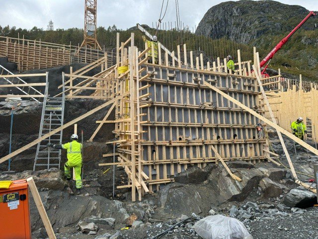 a construction site with workers