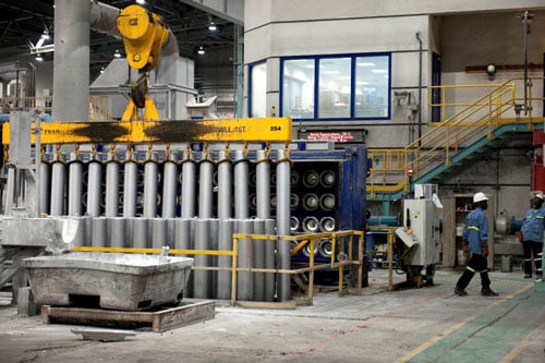 a person walking next to a machine