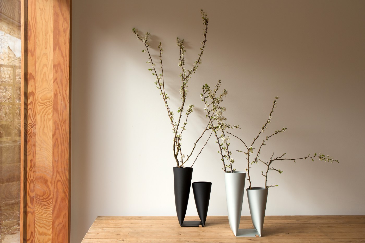 black and white vases on a table